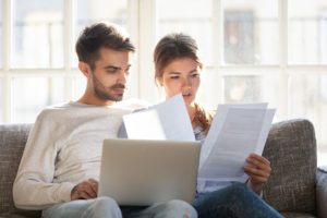 couple collecting proper paperwork for credit dispute