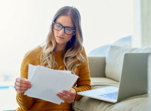 Woman reading credit report